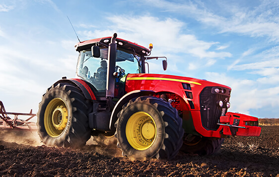 Versatile Tractor with Tillage Attachment